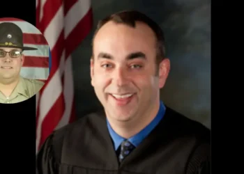 Judge Kevin Mullins in a black robe and Sheriff Shawn M. Stines in uniform, related to the Kentucky Sheriff Charged with Murder of Judge Kevin Mullins case.