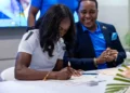 Julien Alfred at the signing ceremony as Saint Lucia's New Tourism Ambassador, marking a historic partnership to promote the island globally.