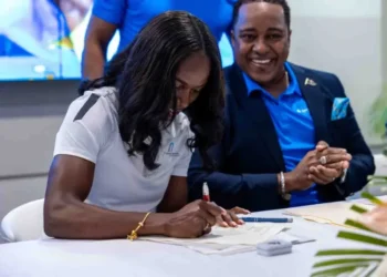Julien Alfred at the signing ceremony as Saint Lucia's New Tourism Ambassador, marking a historic partnership to promote the island globally.