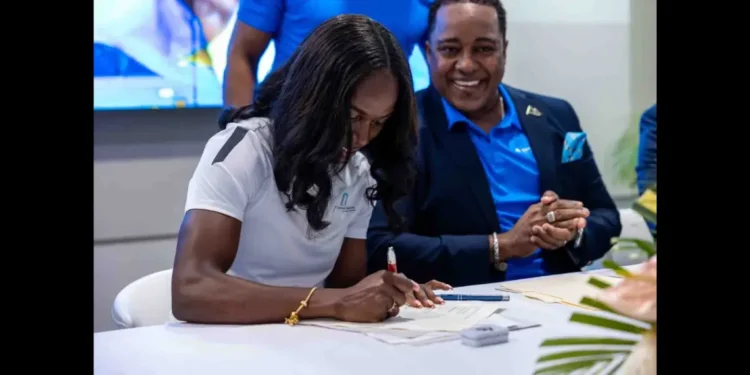 Julien Alfred at the signing ceremony as Saint Lucia's New Tourism Ambassador, marking a historic partnership to promote the island globally.