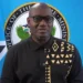 Moses Jn Baptiste under fire as he stands in front of the Office of the Prime Minister seal amid Saint Lucia’s healthcare crisis.