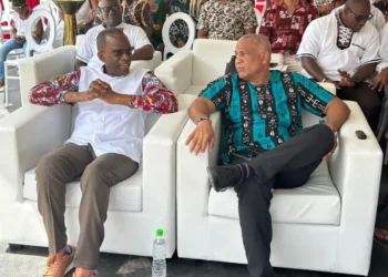 Philip J Pierre and Ernest Hilaire seated side by side at a carnival event amidst the ongoing As the Saint Lucia CIP passport scandal deepens