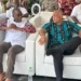 Philip J Pierre and Ernest Hilaire seated side by side at a carnival event amidst the ongoing As the Saint Lucia CIP passport scandal deepens