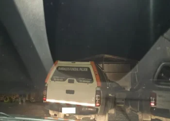 Rambally's Funeral Services arrive at the scene of the grisly Monier stabbing to transport the victim's body. Photo credit: Loop Saint Lucia News.