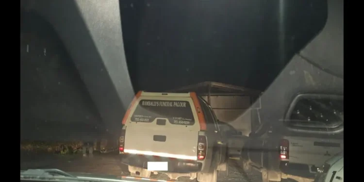 Rambally's Funeral Services arrive at the scene of the grisly Monier stabbing to transport the victim's body. Photo credit: Loop Saint Lucia News.