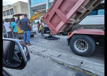 Roads being hastily patched as SLP scrambles to fix roads ahead of Julien Alfred’s homecoming, highlighting infrastructure neglect.