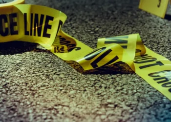 Yellow police line do not cross tape depicting the scene of the Cocao Babonneau shooting, where one person was fatally shot and another injured.