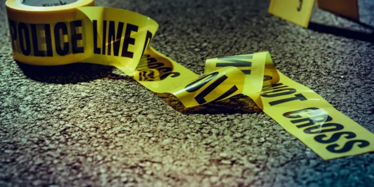 Yellow police line do not cross tape depicting the scene of the Cocao Babonneau shooting, where one person was fatally shot and another injured.