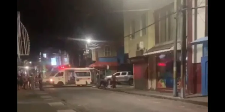 Ambulance on the scene of Chaussee Road shooting in Castries, responding to the emergency.