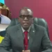 Philip J Pierre and Philippe Martinez against a red background amid growing controversy in the Philip Pierre scandal involving the alleged misuse of taxpayer funds.