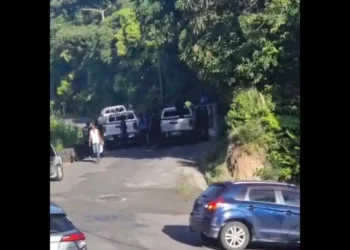 Police at the scene of Bagatelle police shooting, showing officers investigating after fatal confrontation.