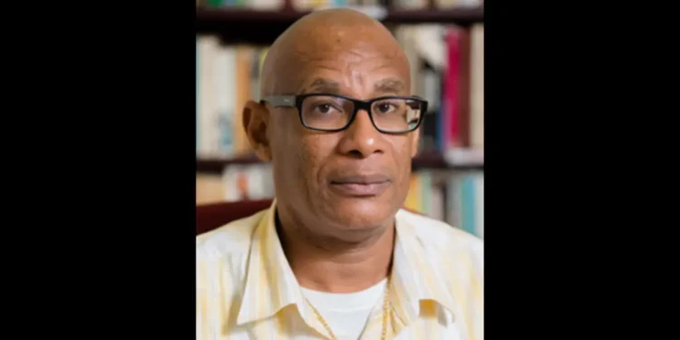 Portrait of Damian Greaves in a yellow shirt, symbolizing Damian Greaves return to OKEU Hospital amid renewed fears of healthcare failures.