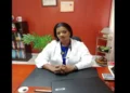 Resignation of Dr Merle Clarke: Dr. Merle Clarke in a lab coat sitting at her desk, reflecting on Saint Lucia’s healthcare challenges