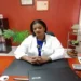 Resignation of Dr Merle Clarke: Dr. Merle Clarke in a lab coat sitting at her desk, reflecting on Saint Lucia’s healthcare challenges