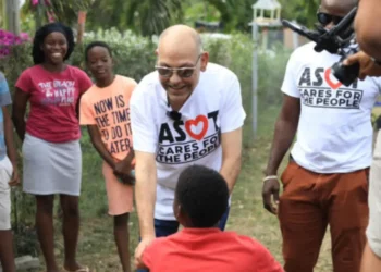 Asot Michael, known for his community outreach, pictured meeting and greeting children before his tragic death. Asot Michael death has shocked the nation.