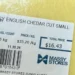 Image of a $16.43 block of English cheddar cheese from Massy Stores, highlighting Saint Lucia cheese prices amid cost of living concerns.