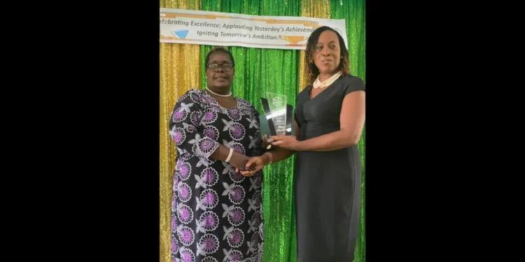 Jennifer Pierre retirement ceremony as she receives an award for 34 years of dedicated service at Piaye Combined School.