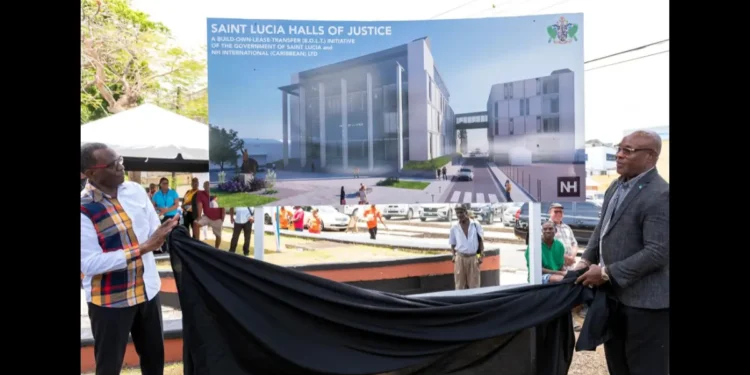 Prime Minister Philip J. Pierre and Minister Richard Frederick unveiling the Halls of Justice project billboard, showcasing plans amid the Halls of Justice seawater crisis in Saint Lucia.