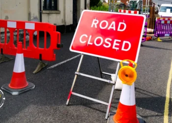 Road closed sign and barriers at a construction site, highlighting ongoing St Lucia roadworks and temporary traffic adjustments.