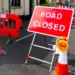 Road closed sign and barriers at a construction site, highlighting ongoing St Lucia roadworks and temporary traffic adjustments.