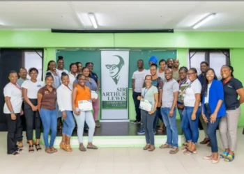 2024 Sir Arthur Lewis Community College graduates, central to the St Lucia Teachers Salary Dispute, posing with certificates.
