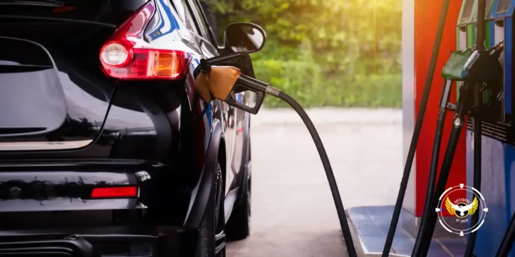 Black vehicle refueling, highlighting the benefits of lower fuel prices in Barbados for consumers.