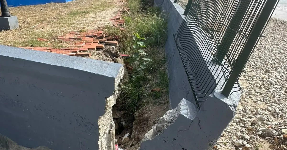 Crumbling section of Gros Islet park infrastructure showing damaged fencing and collapsed walls, highlighting construction flaws. Crumbling section of Gros Islet park infrastructure showing damaged fencing and collapsed walls, highlighting construction flaws.
