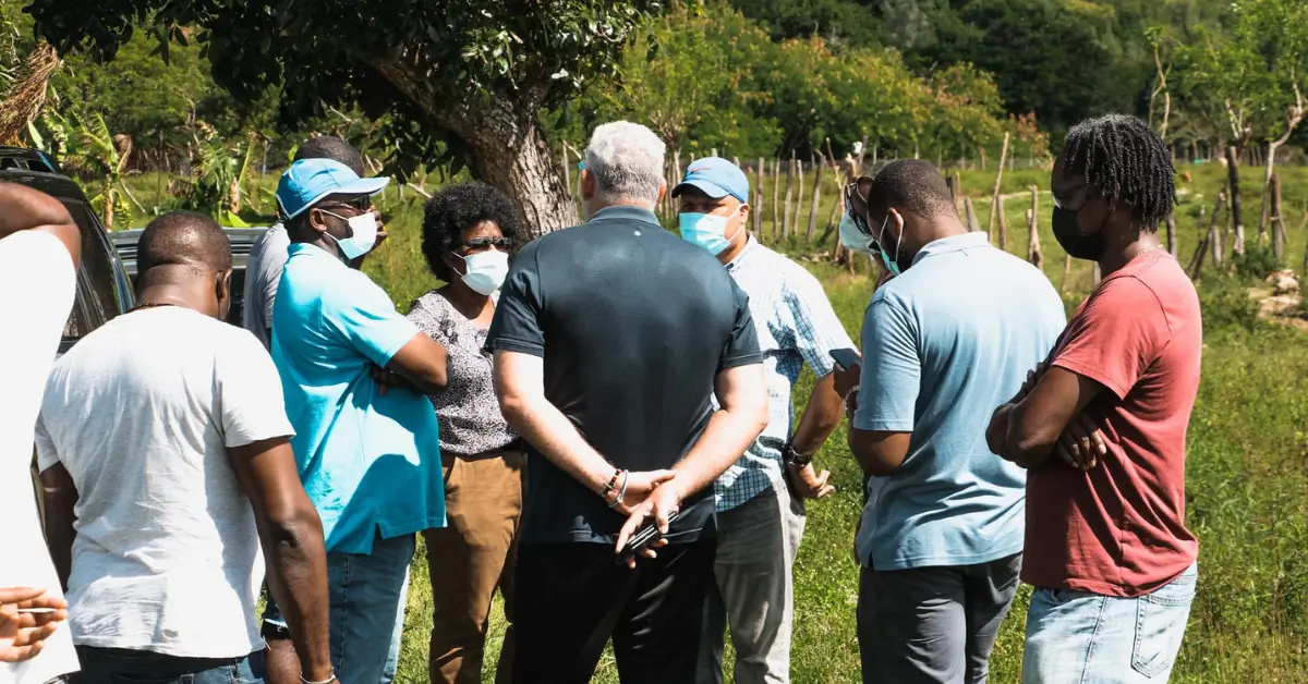 Group discussion at the proposed drag racing site in Dennery, highlighting proactive efforts as Kenson Casimir exposed for failing to address the Cacabef lease controversy.