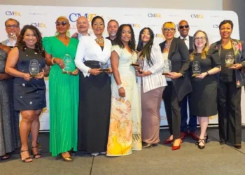Honorees at the CMEx Caribbean Leadership Awards proudly display their accolades, celebrating achievements in tourism and leadership.