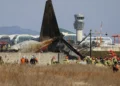 Image showing the wreckage of the Jeju Air crash at Muan International Airport in South Korea, with emergency responders on-site. Credit AP News