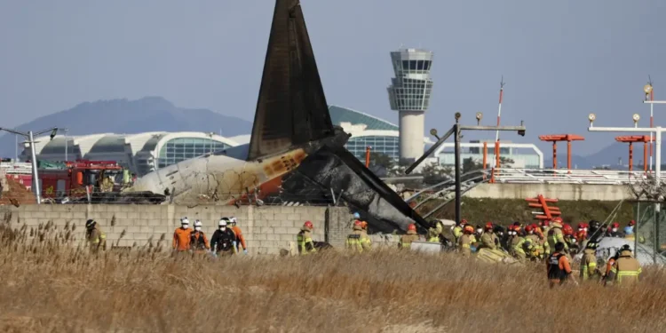 Image showing the wreckage of the Jeju Air crash at Muan International Airport in South Korea, with emergency responders on-site. Credit AP News