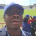 Kenson Casimir exposed at the Daren Sammy Cricket Stadium during a public appearance, sparking further controversy over his recent statements.