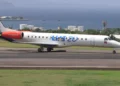 LIAT Antigua-Kingston route aircraft preparing for takeoff in St. Kitts, enhancing Caribbean travel connectivity.