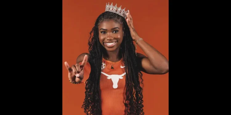 Naomi London in Texas Longhorns uniform, smiling with a crown and hand gesture.