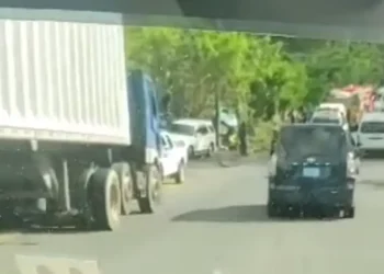 Scene of a major accident in Dennery showing emergency personnel and vehicles responding after a truck reportedly hit STEP workers.