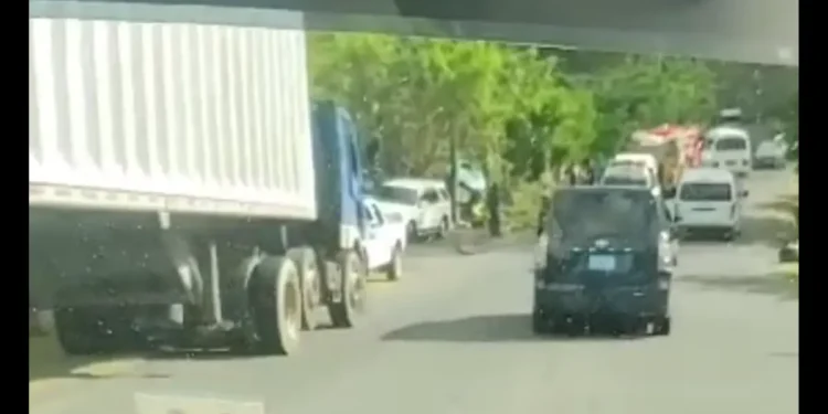 Scene of a major accident in Dennery showing emergency personnel and vehicles responding after a truck reportedly hit STEP workers.