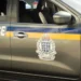 Side view of a Royal Saint Lucia Police Force vehicle, featuring official insignia and markings, actively used in the Vincentian National Shooting investigation on Water Works Road.
