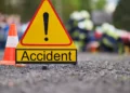 Stock image depicting emergency response at the scene of a Bois Dorange accident, with an accident warning sign in focus.