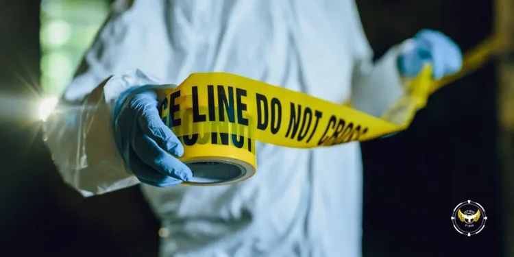 Stock image of a crime scene investigator unrolling yellow tape, symbolizing the investigation into the Delcer Stabbing Incident in Saint Lucia.