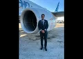 Tevin Belasco, a St. Lucian pilot, standing confidently in front of an American Airlines aircraft, celebrating his historic milestone.