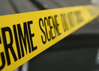 Yellow crime scene tape depicting the area of the Belair Goods Vehicle Robbery in Saint Lucia, where a passenger was shot during the incident.