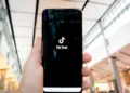 A smartphone displaying the TikTok logo, representing Biden deferring TikTok decision amid national security debates.