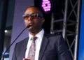 FICS Chairman Lorne Theophilus speaking at an event, emphasizing the FICS ECCB appointment and the institution's future direction.