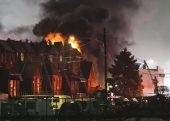 First responders at the scene of the deadly Philadelphia plane crash, where a Learjet crash ignited a fireball, engulfing homes in flames. (Credit AP)
