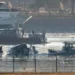 First responders recover debris from American Airlines crash near Reagan Airport.