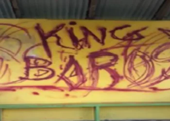 Graffiti reading King Baros defacing a bus shelter in Belle Vue, highlighting the Belle Vue vandalism incident addressed by the RSLPF crackdown.