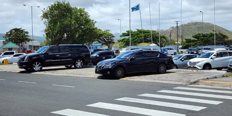 Hewanorra Airport parking lot with multiple vehicles, showcasing the area impacted by SLASPA parking fee hike effective January 27, 2025.