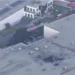 Scene of the California plane crash in Fullerton showing damaged building and responders