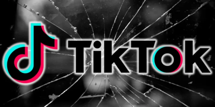 TikTok logo on a cracked screen, symbolizing TikTok Goes Dark in the U.S. amid a federal ban.