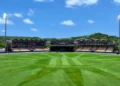 Daytime view of the Daren Sammy Cricket Ground with its well-manicured pitch and iconic grandstands under a bright Saint Lucian sky.